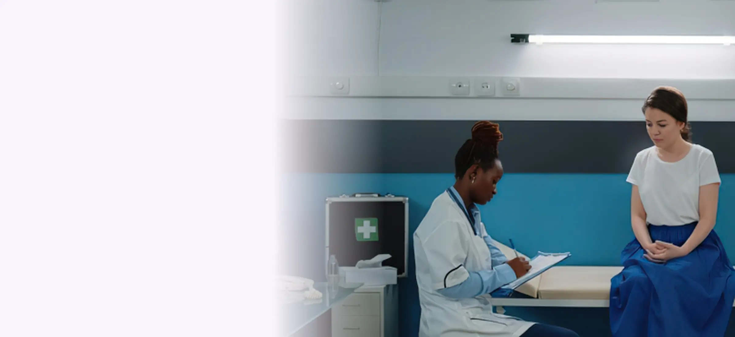 A doctor taking notes during a consultation with a patient in a Kenyan clinic