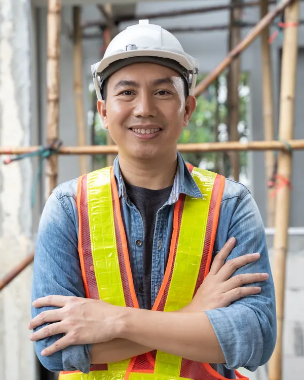 An engineer in a hard hat on site